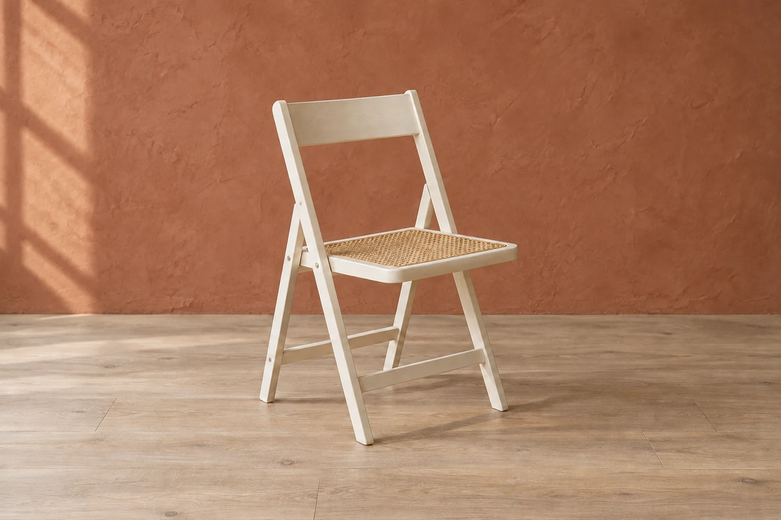 Actual generated edit with a terracotta wall visible both around the chair and below its backrest
