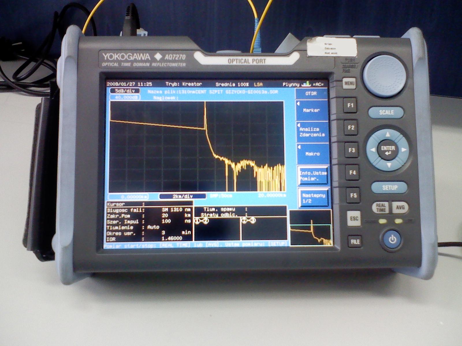 An actual Yokogawa AQ7270 OTDR on a calibration stand